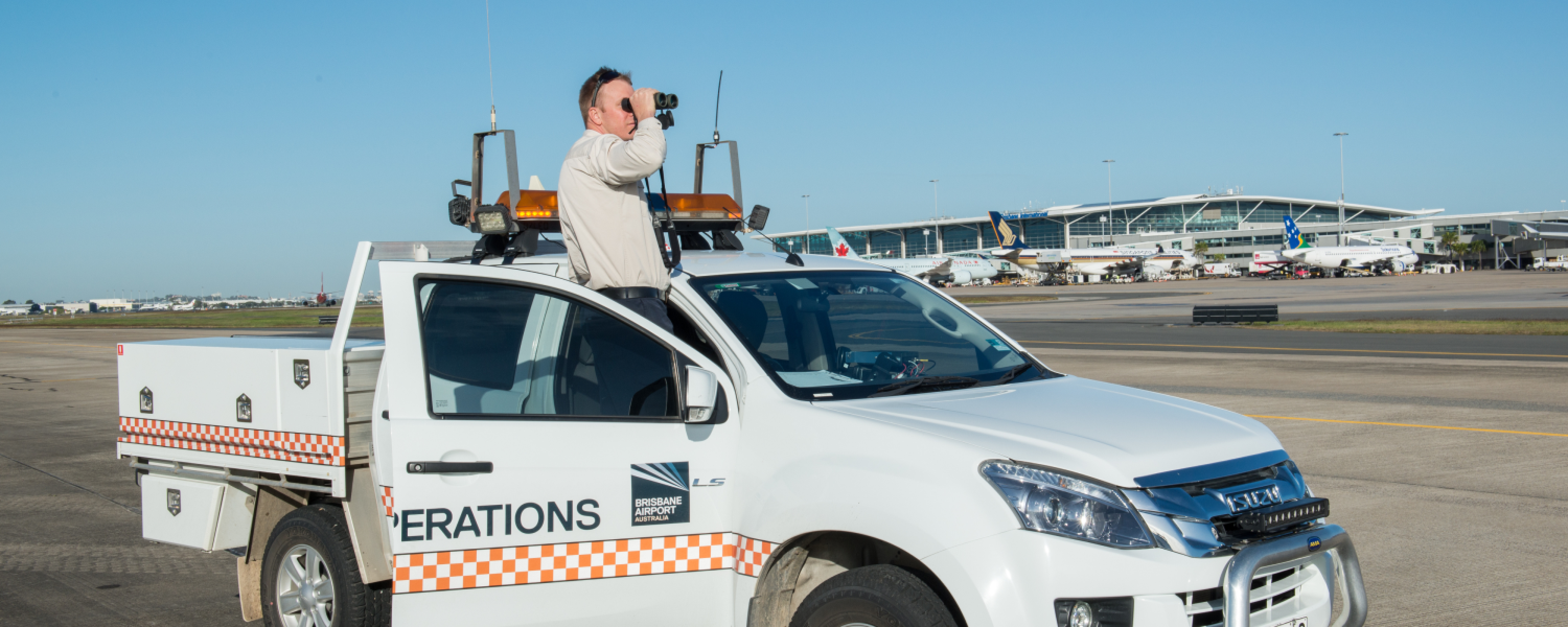 Man with telescope on a UTE