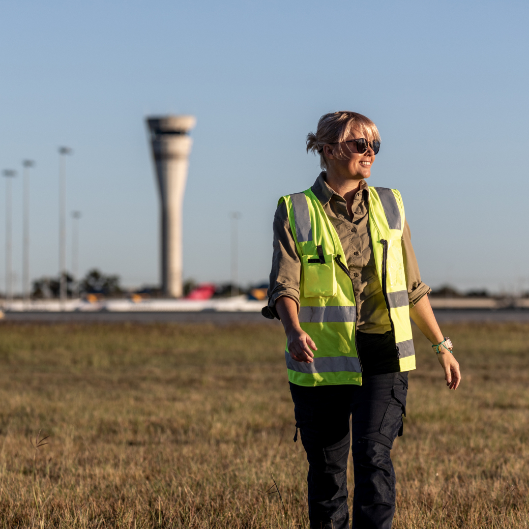 Aerodrome reporting officer walking on field