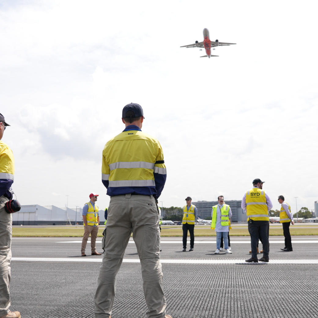 Airport people looking up to aeroplane
